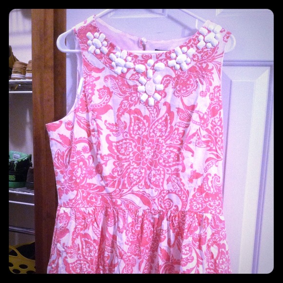 Pink and white sleeveless dress.