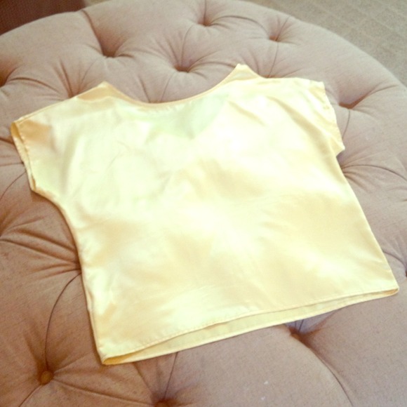 Got this at a boutique. Great canary yellow shirt
