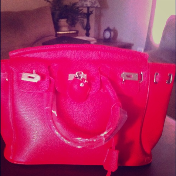 Red handbag with lock and key
