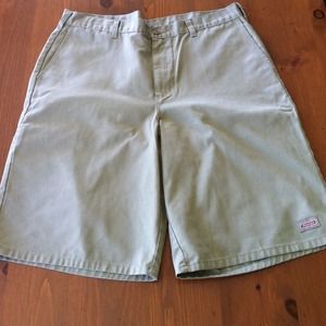 Tan Dickies shorts.