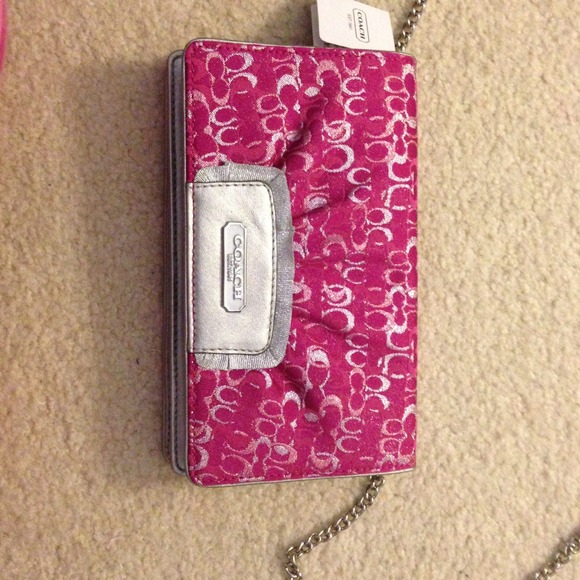 Coach clutch. Still with tags.  Pink and silver.