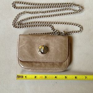 Beige Hobo International crossover purse.