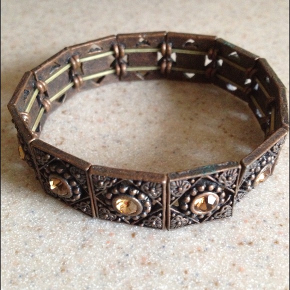 Brownish/orange stone set in bronze bracelet