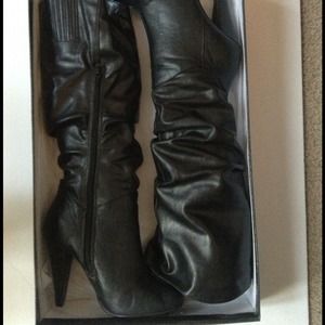 Used black knee high boots. 🌻