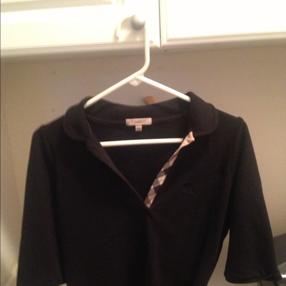 Woman's black burberry polo shirt and teal