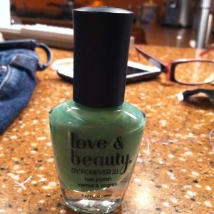 Shimmering sage green nail polish
