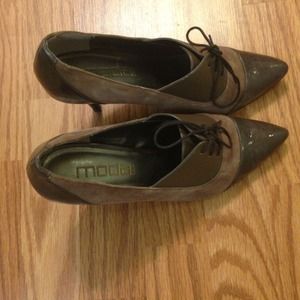 A pair of lace-up high heel shoes/booties like new