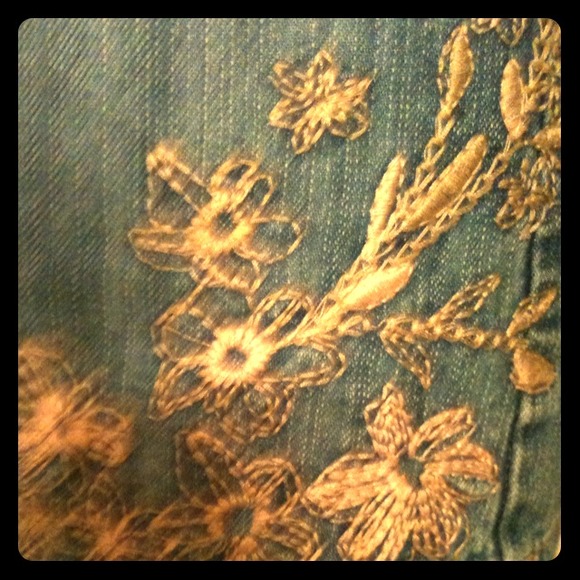 Denim "skort" with floral embroidery.