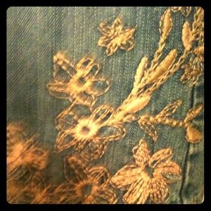 Denim "skort" with floral embroidery.