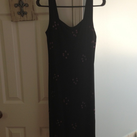 A little black dress with beautiful pink flowers.