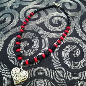 Red and black necklace with large heart charm
