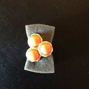 3 stone orange & brushed gold tone ring.