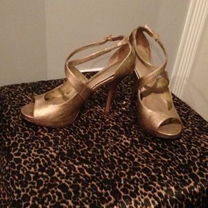 Gold strappy pumps.
