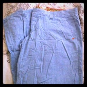 Baby blue and white pinstriped trousers.