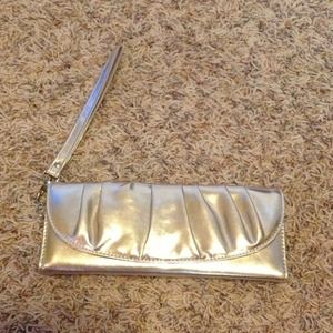 SOLD Gold wristlet clutch