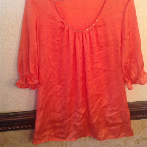 Orange satin material blouse