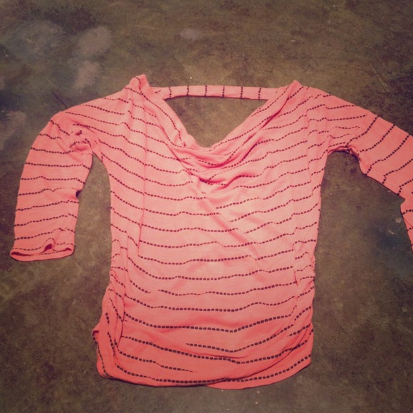 Peach colored 3/4 length shirt with black stripes.