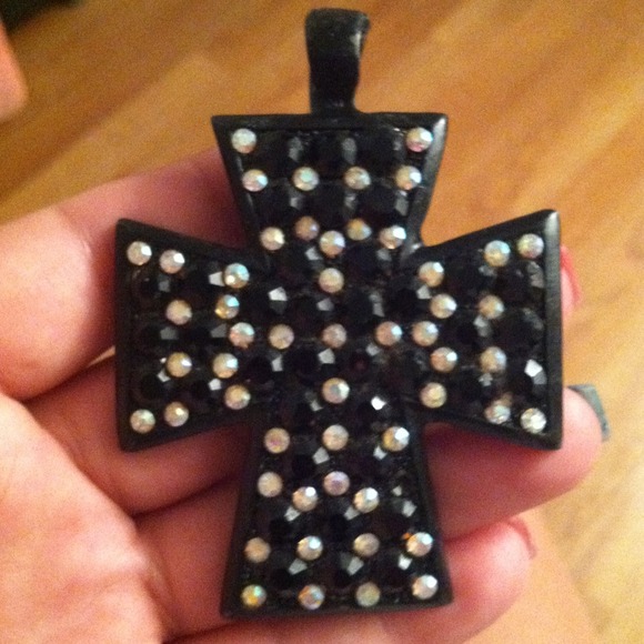 Cross that goes on a necklace