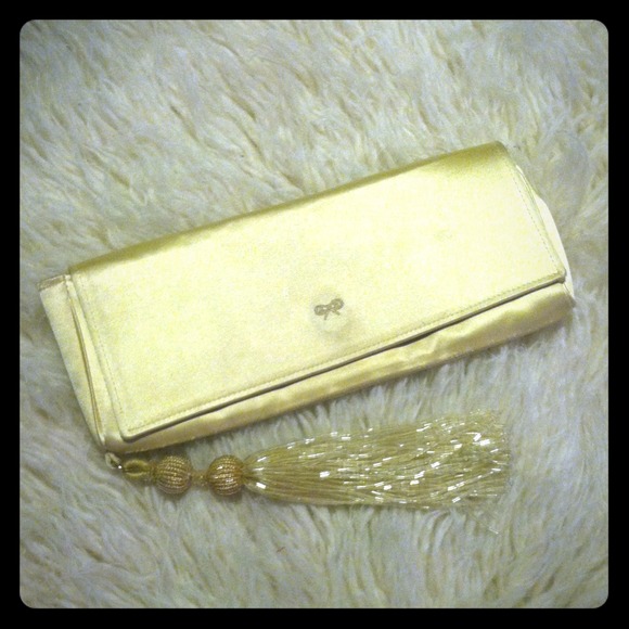 ANYA HINDMARCH pale gold silk clutch with tassel