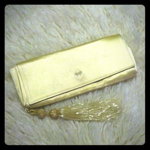 ANYA HINDMARCH pale gold silk clutch with tassel