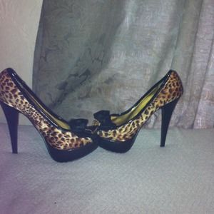 Cheetah print heels good condition .