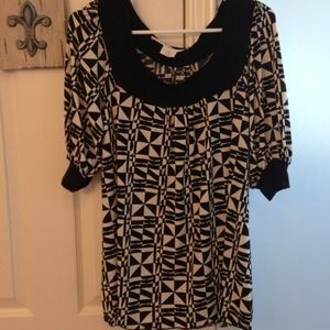 A pull over diamond patterned black/white blouse.