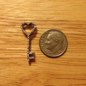 Sterling silver and diamond key necklace pendant