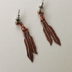 Copper feather earrings.