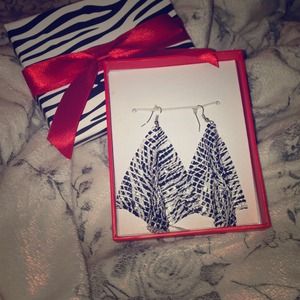 Zebra print dangle earrings cheek