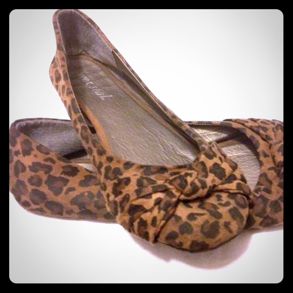 lightly worn leopard-print flats