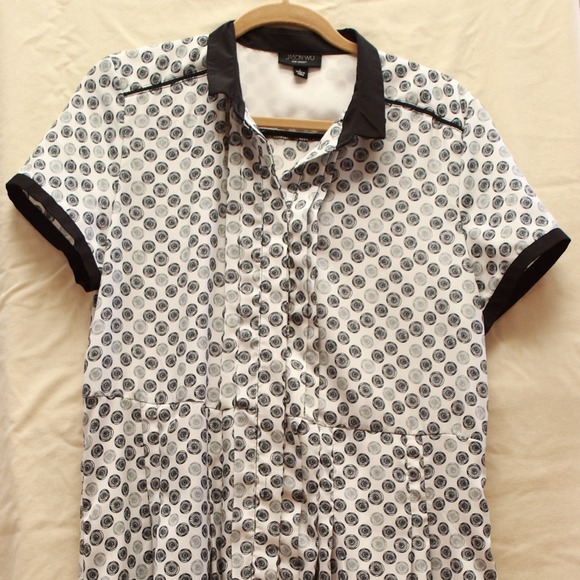 A white dress with black print.