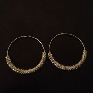 Crystal encrusted charms on hoop earrings