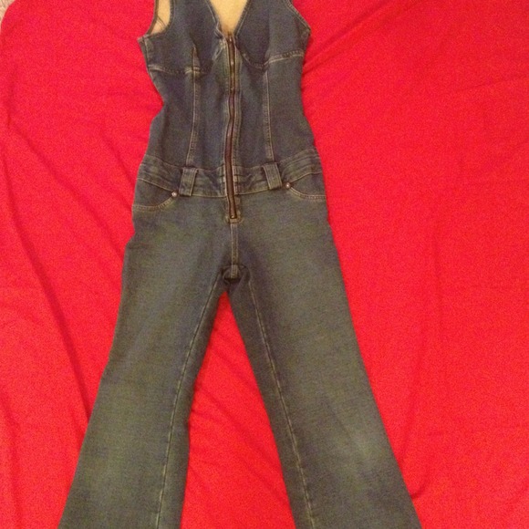 JLO one piece form fitting denim outfit.