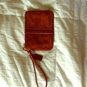 Small authentic Coach burgundy suede wristlet
