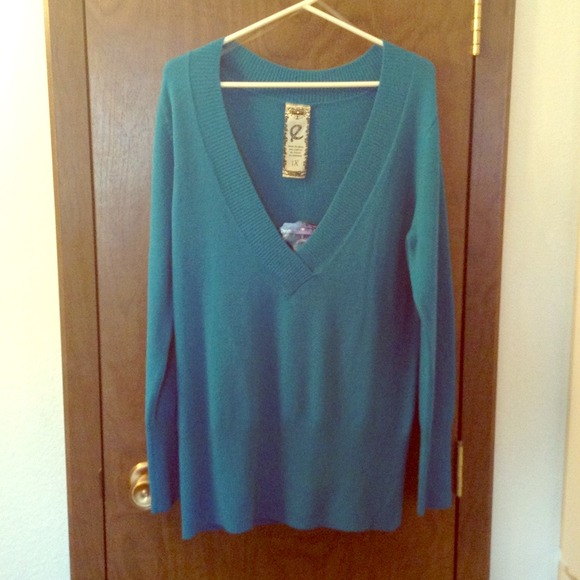 Brand new low v-neck sweater.