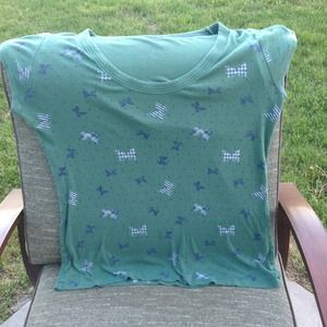 Green tee with butterflies on it
