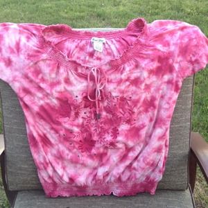 Pink tie- dye shirt and flowery design on front