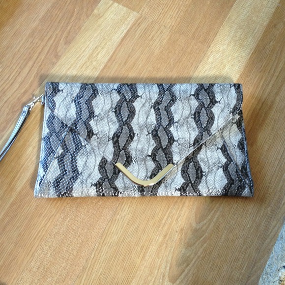 Clutch. Silver and snake skin print. New.