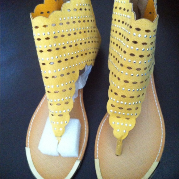 Yellow suede sandals.