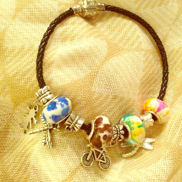 Black cord bracelet with beads and charms