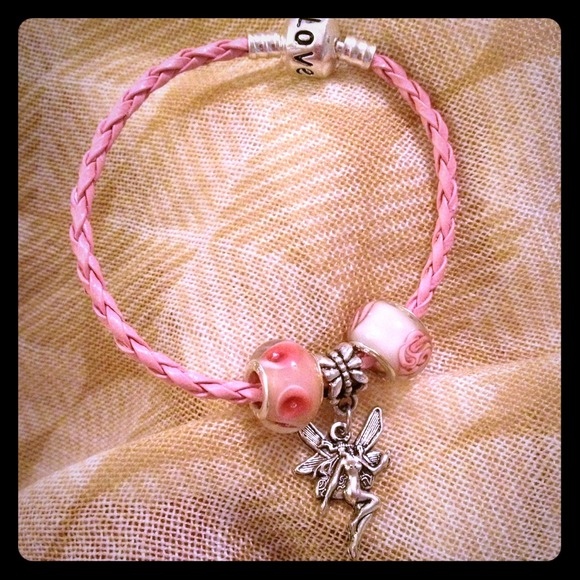 Pink corded bracelet with2 beads and fairy charm