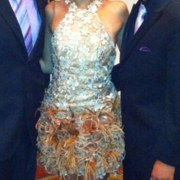 Designer dress. Cream with feathers