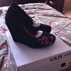 Brand new Unlisted size 7 black wedge shoes.