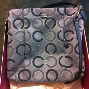 Brand new Coach purse still in silk bag and box