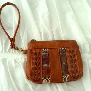Brown leather wristlet with design