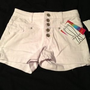 High waisted white shorts.