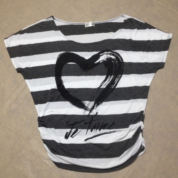 A gray and white off shoulder top with design.