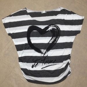 A gray and white off shoulder top with design.