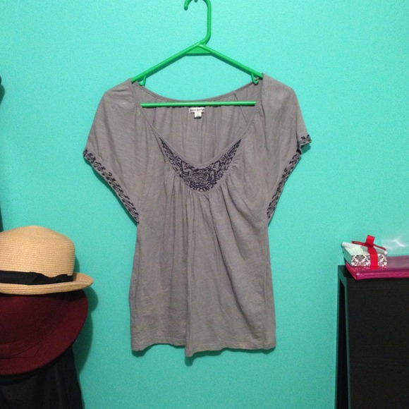 A grey loose shirt that flows