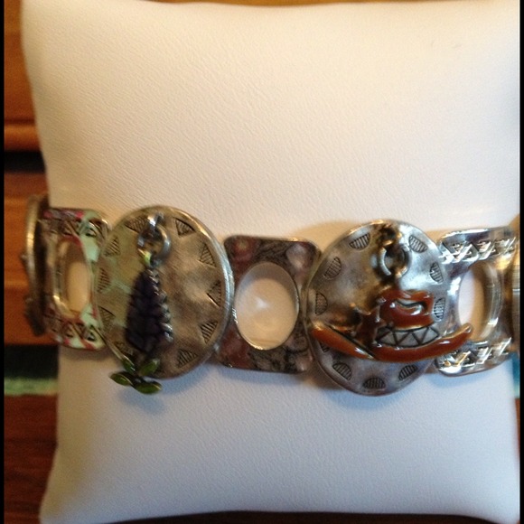 Silver bracelet with charms